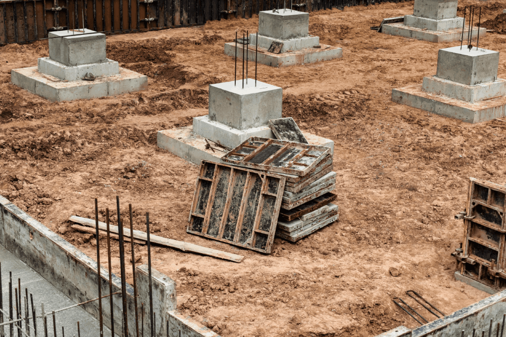 Monolithic reinforced concrete foundations for the construction of a large building. Rostverk at the construction site. Construction pit with foundation. close-up<br />